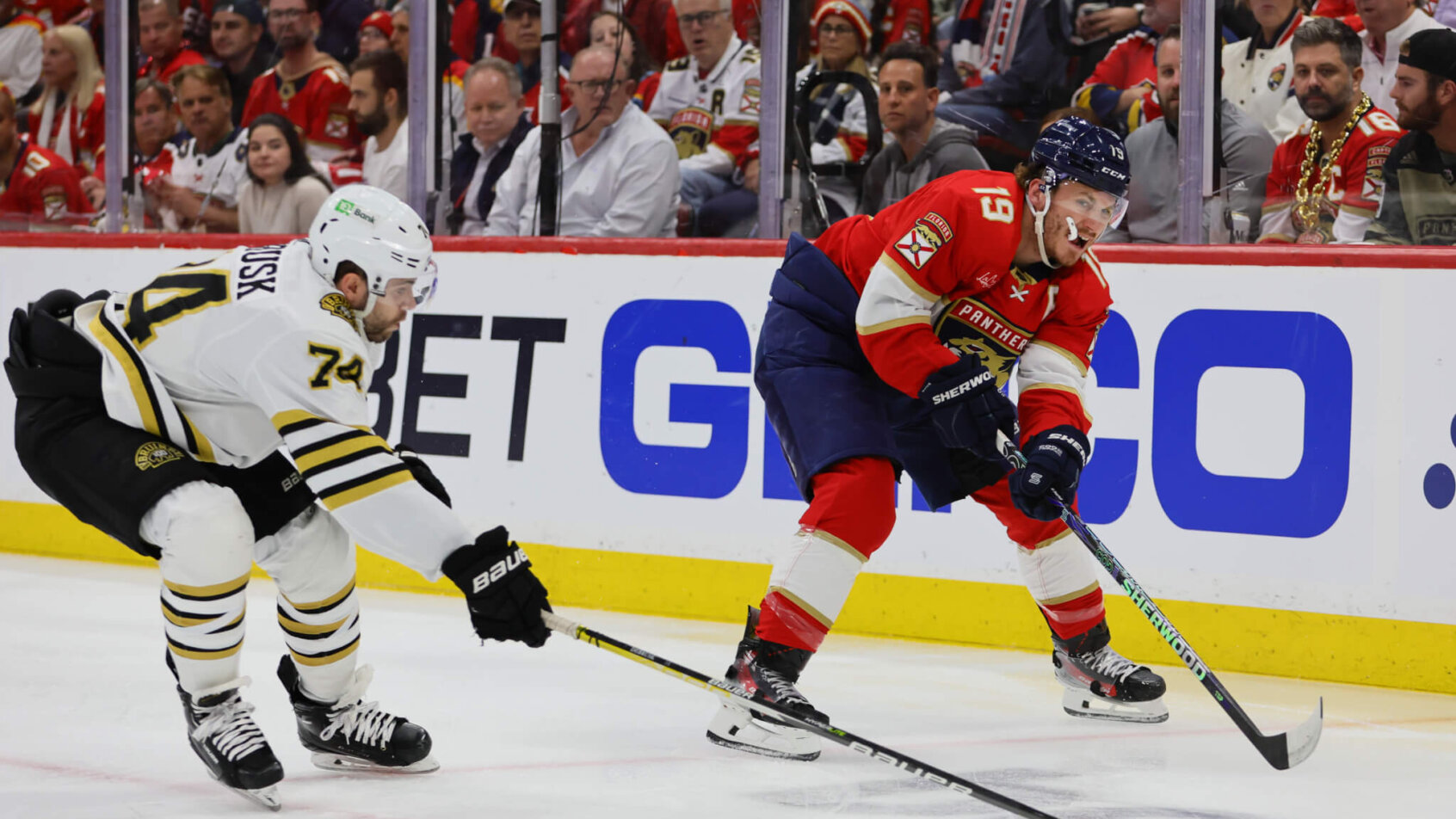 Florida Panthers left wing Matthew Tkachuk moves the puck as Boston Bruins left wing Jake DeBrusk