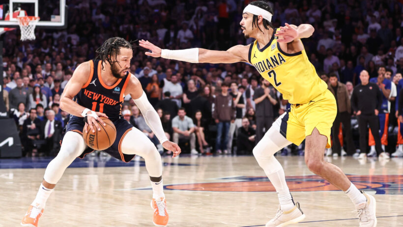 New York Knicks guard Jalen Brunson dribbles while Indiana Pacers guard Andrew Nembhard defends