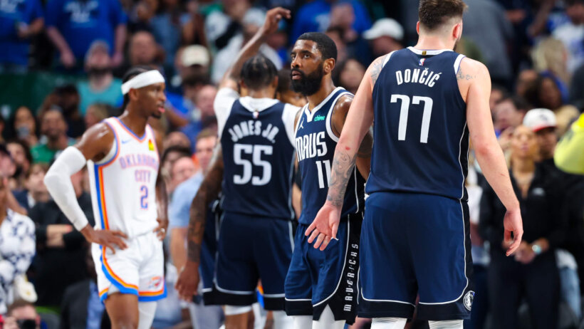 Dallas Mavericks guards Kyrie Irving and Luka Doncic celebrate after a basket