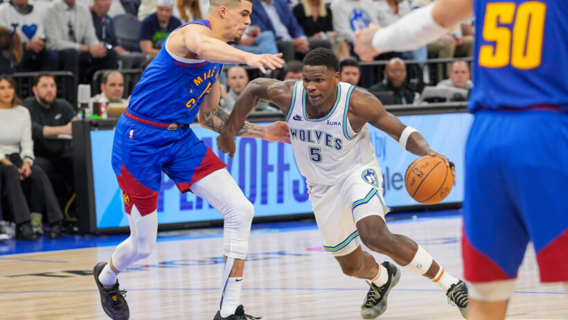 Minnesota Timberwolves guard Anthony Edwards drives past Denver Nuggets forward Michael Porter Jr
