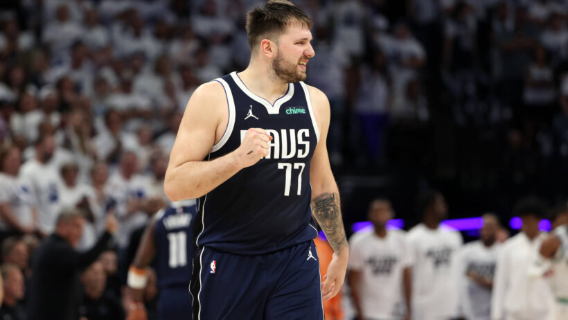 Dallas Mavericks guard Luka Doncic fist pumps after making a basket