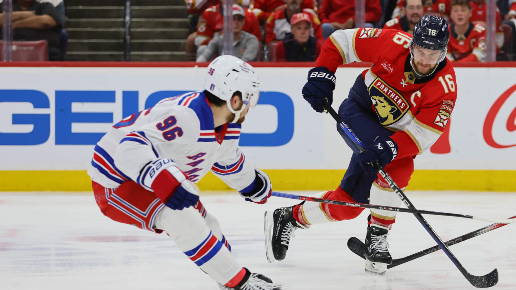 Florida Panthers center Aleksander Barkov moves the puck as New York Rangers center Jack Roslovic