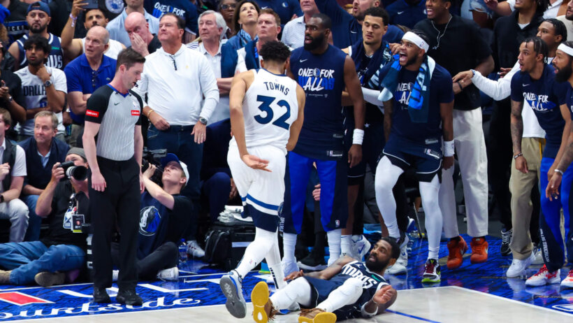 Dallas Mavericks guard Kyrie Irving hits the floor after hitting a shot