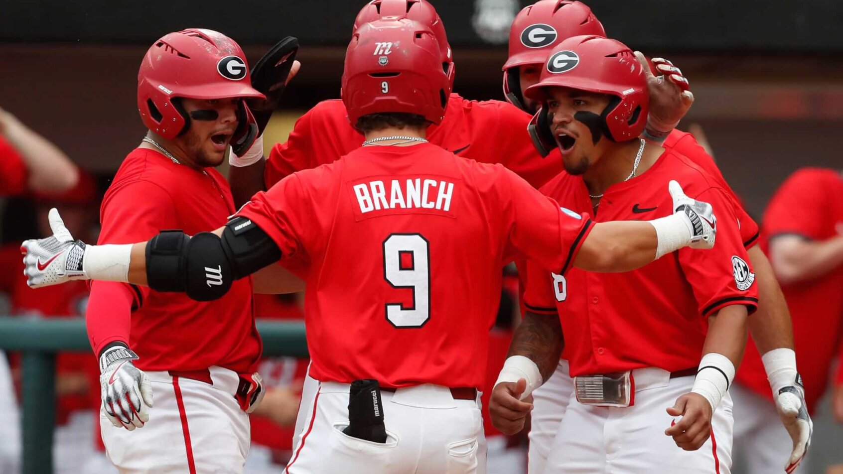 Georgia's Kolby Branch celebrating with teammates at home plate