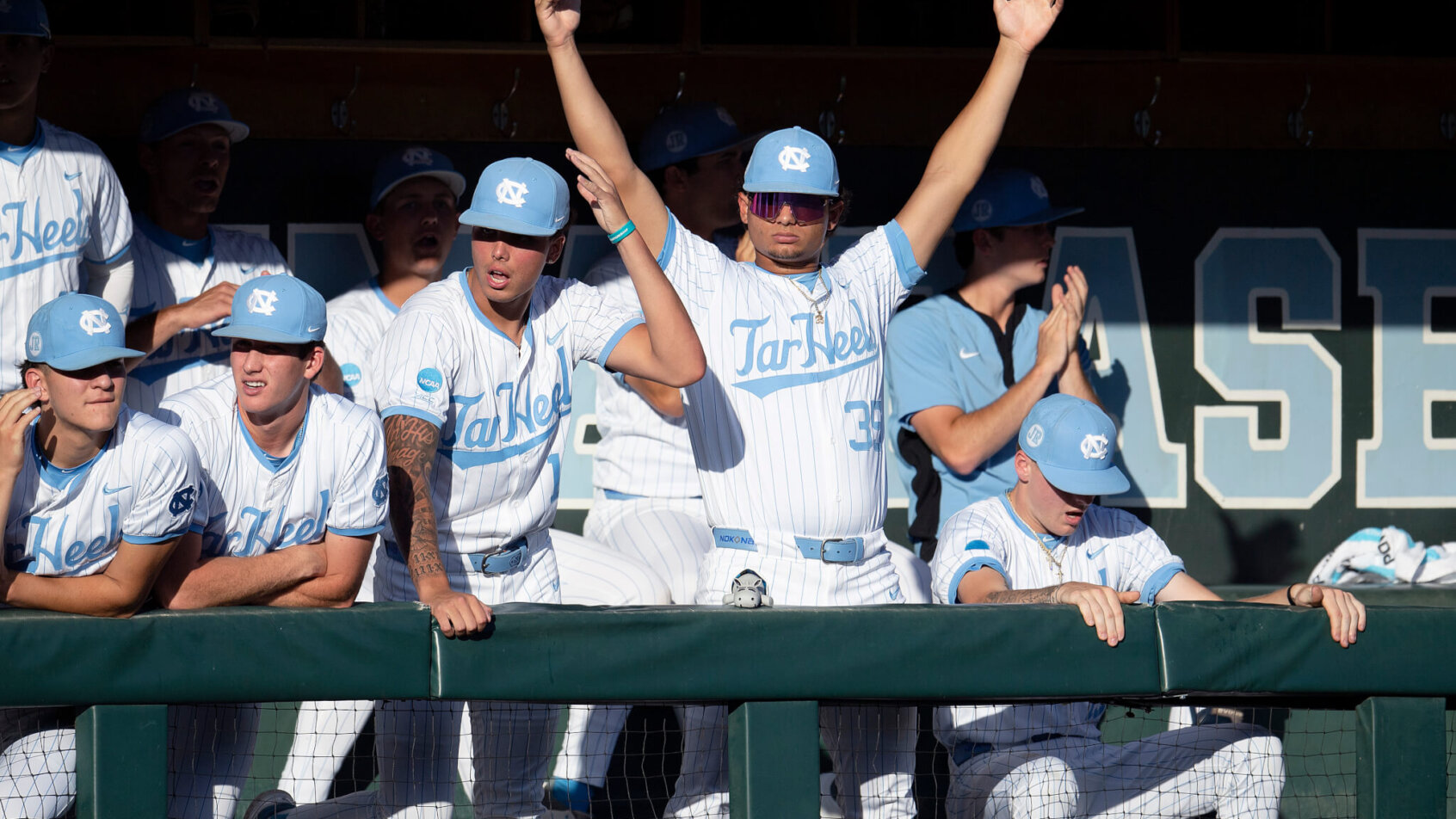 North Carolina cheering in their dugout during the Chapel Hill Super Regionals