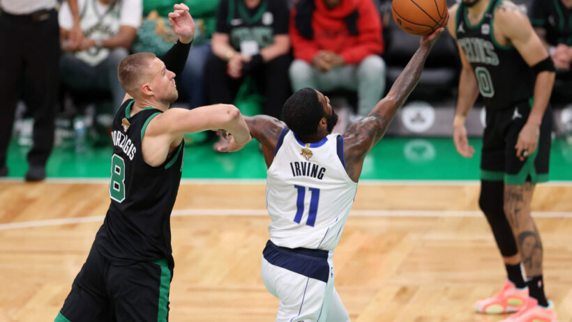 Dallas Mavericks guard Kyrie Irving goes for a layup against the Boston Celtics