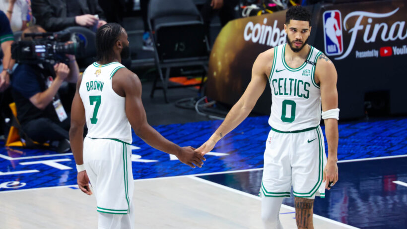 Boston Celtics forward Jayson Tatum guard Jaylen Brown slapping hands on the court