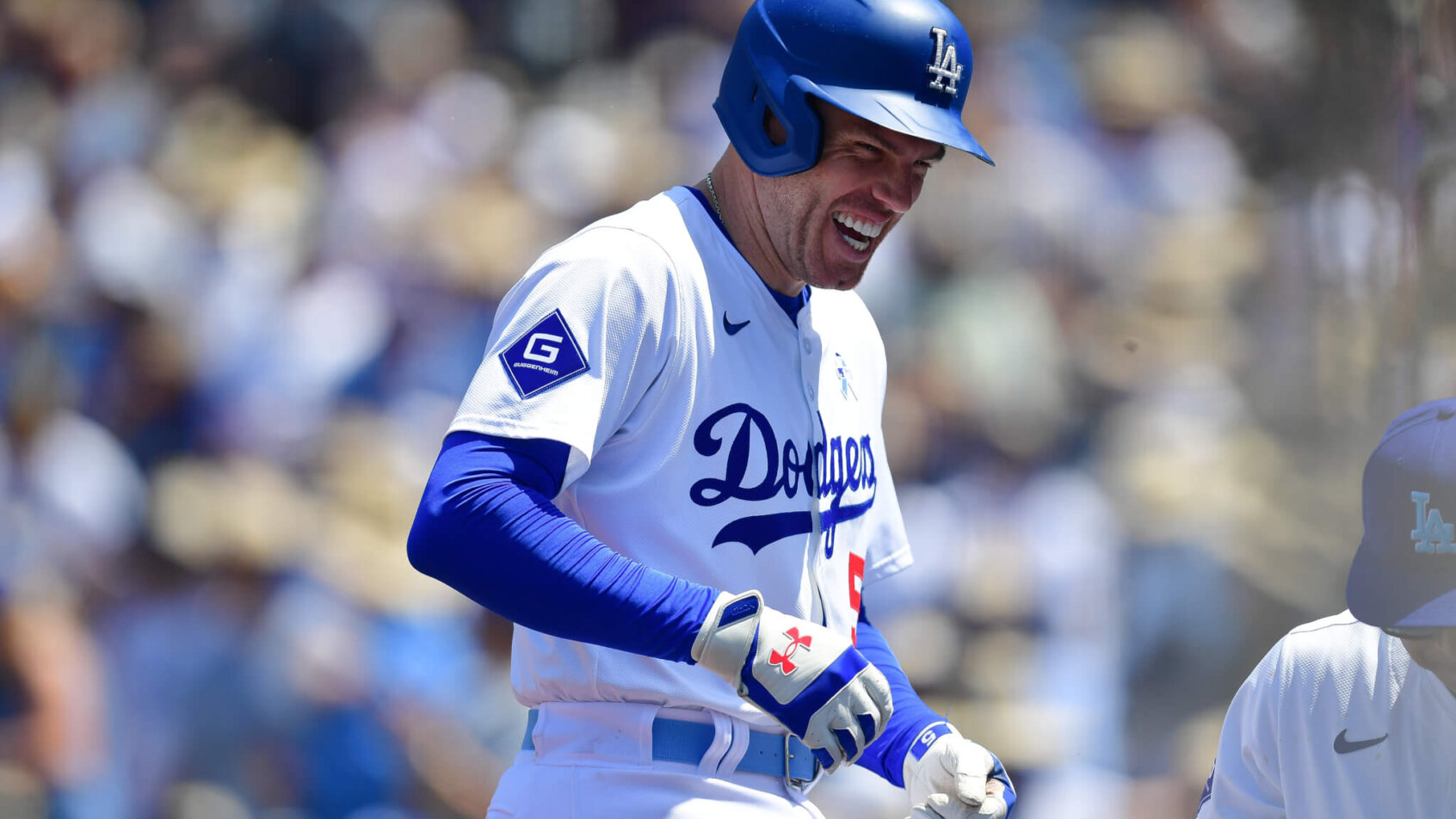 Freddie Freeman of the Los Angeles Dodgers laughs after hitting a home run against the Kansas City Royals.