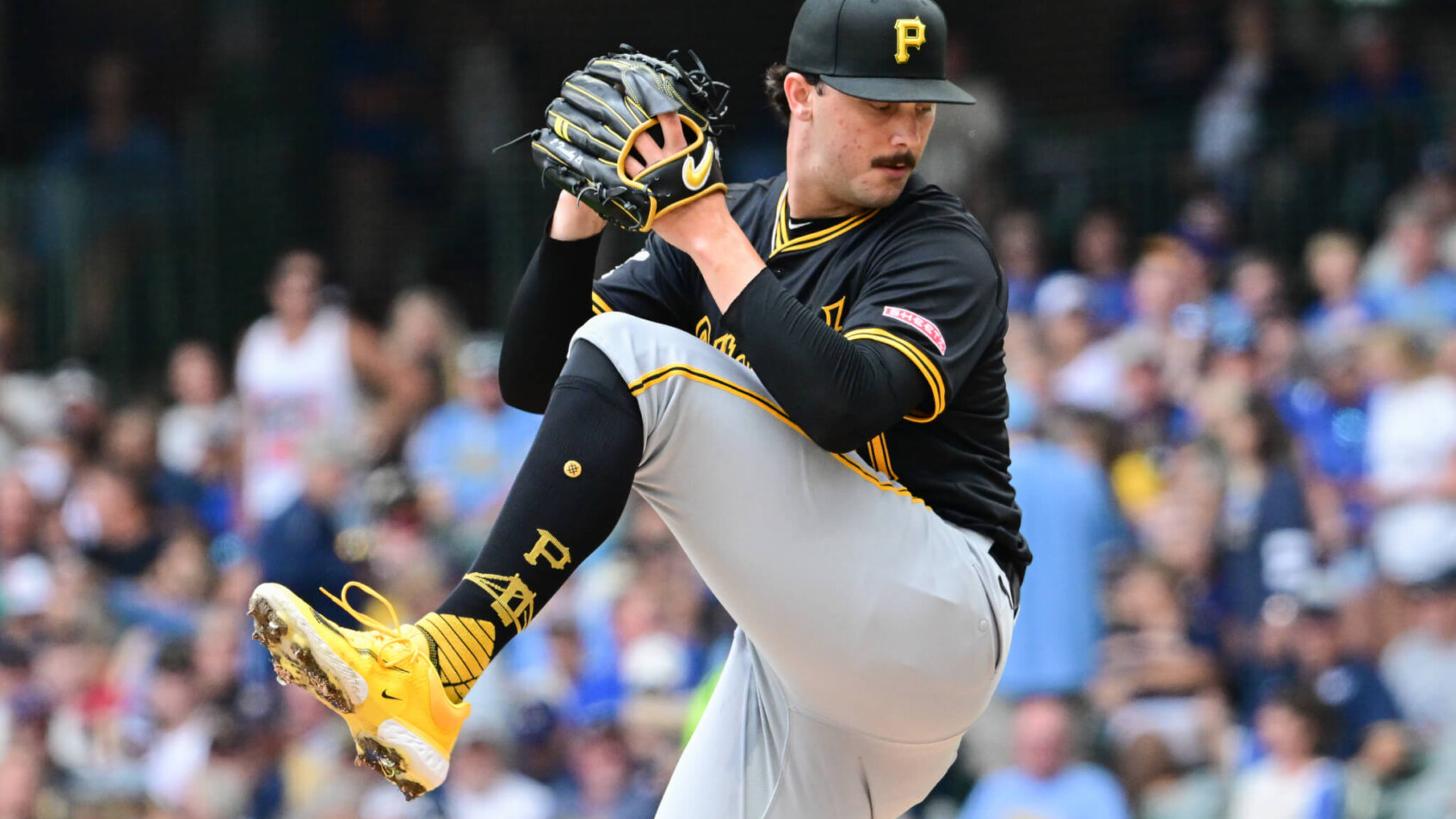 Pittsburgh Pirates starting pitcher Paul Skenes mid-windup