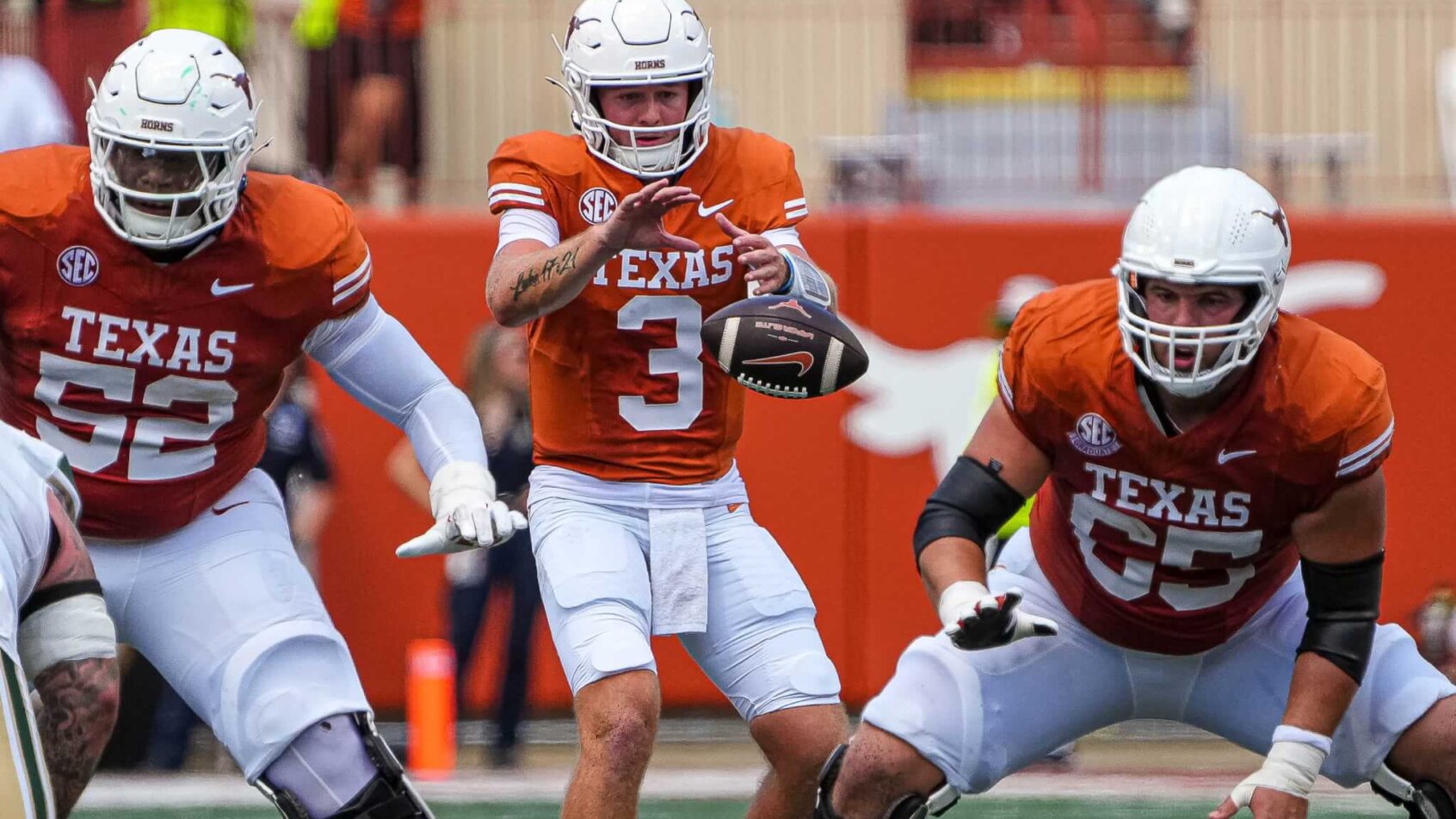 Texas Longhorns quarterback Quinn Ewers receives the snap