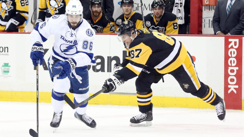 Tampa Bay Lightning right wing Nikita Kucherov chases the puck against Pittsburgh Penguins center Sidney Crosby