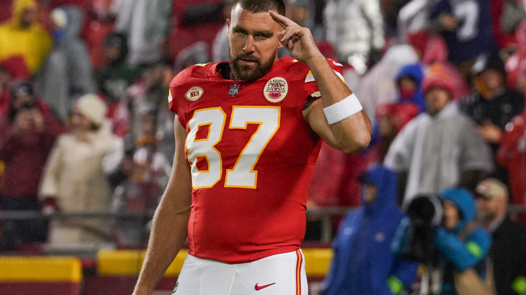 Travis Kelce signaling to fans
