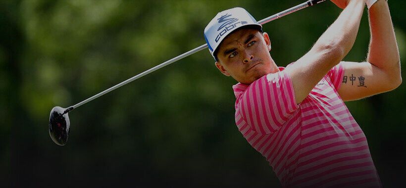 rickie fowler swinging a golf club