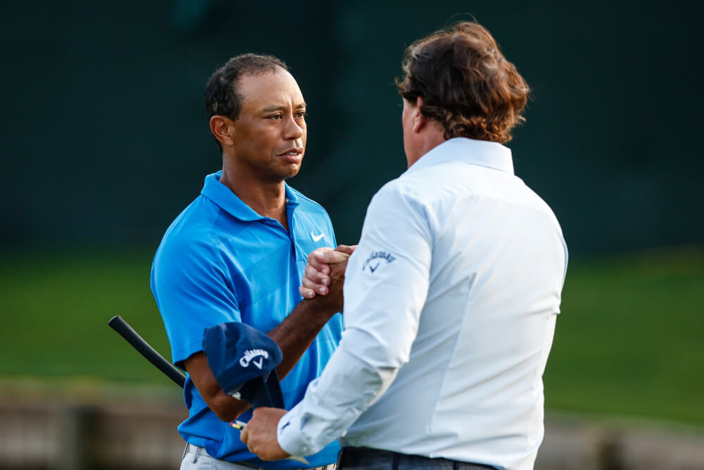 Tiger and Phil embrace