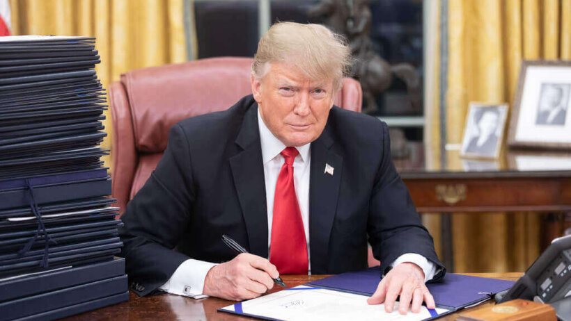 Trump signing documents