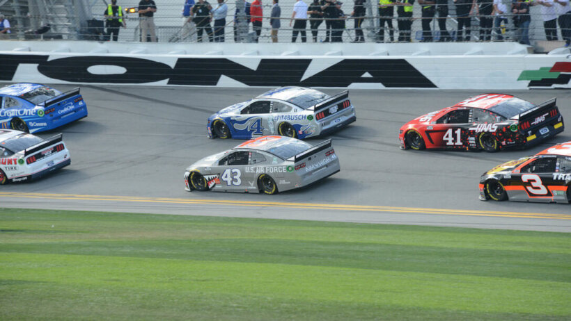 Daytona 500 drivers making a turn.