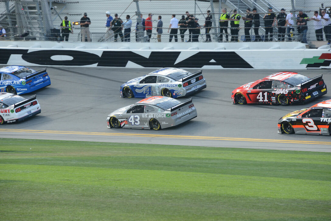 Daytona 500 drivers making a turn.