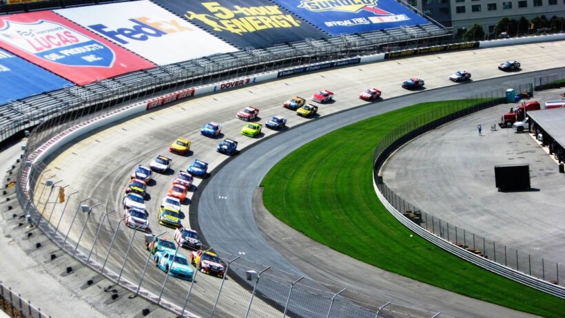 Drivers making the final turn at Dover.