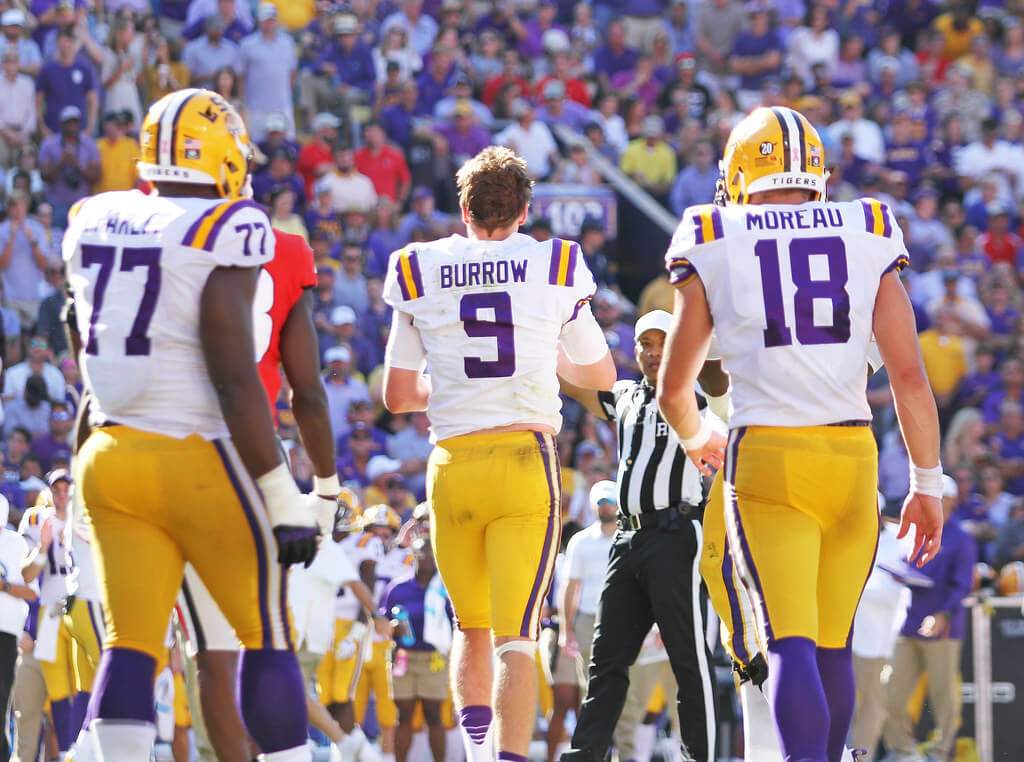 Joe Burrow running onto the field.