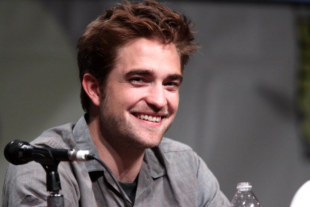 Robert Pattinson sitting