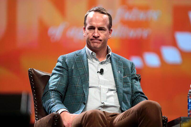 Peyton Manning sitting in a chair