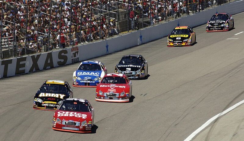 Drivers making a turn at Texas Motor Speedway.