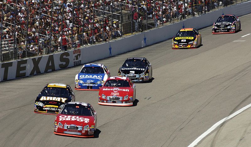 Drivers making a turn at Texas Motor Speedway.