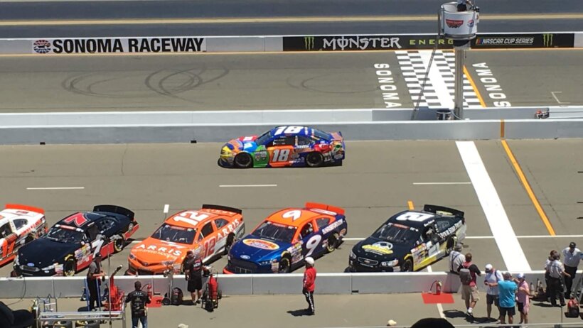 Kyle Busch and others racing.