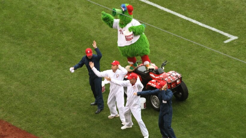 Phillies players on the field with the Phanatic