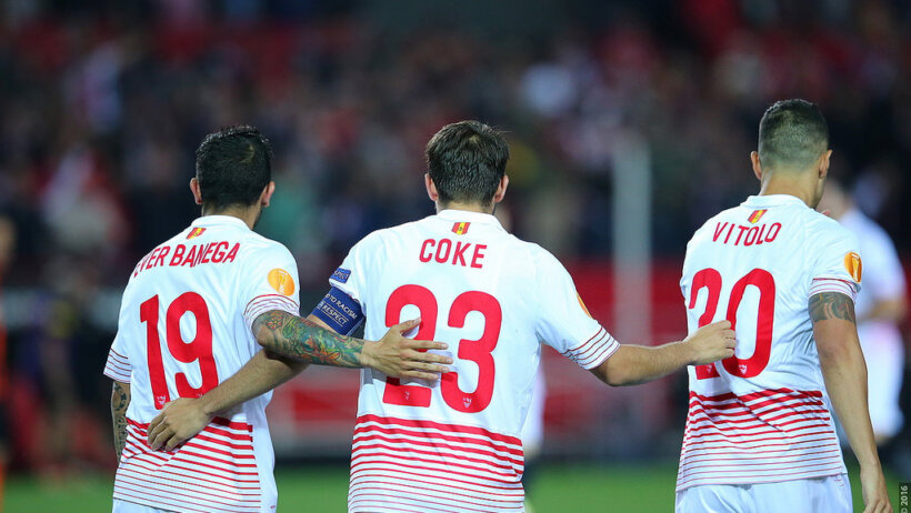 Sevilla team embracing
