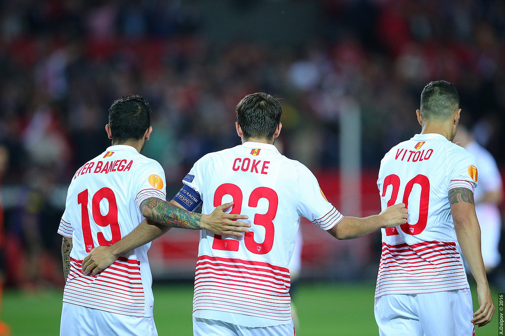 Sevilla team embracing